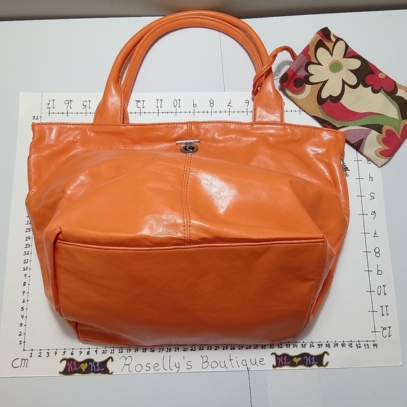 New. Stunning vibrant orange bag with floral lining. Matching wrist wallet . - Picture 1 of 4